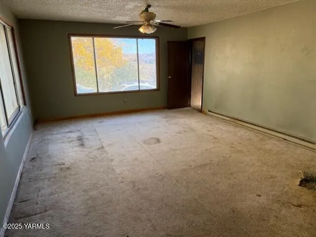 an empty room with windows and entrance