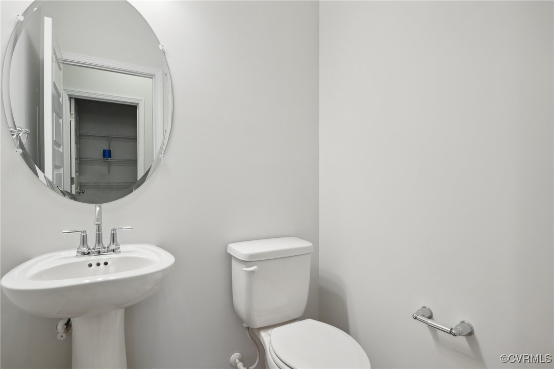 218 That Way Midlothian, VA 23114 - Photo 16 of 22 a bathroom with a toilet sink and mirror