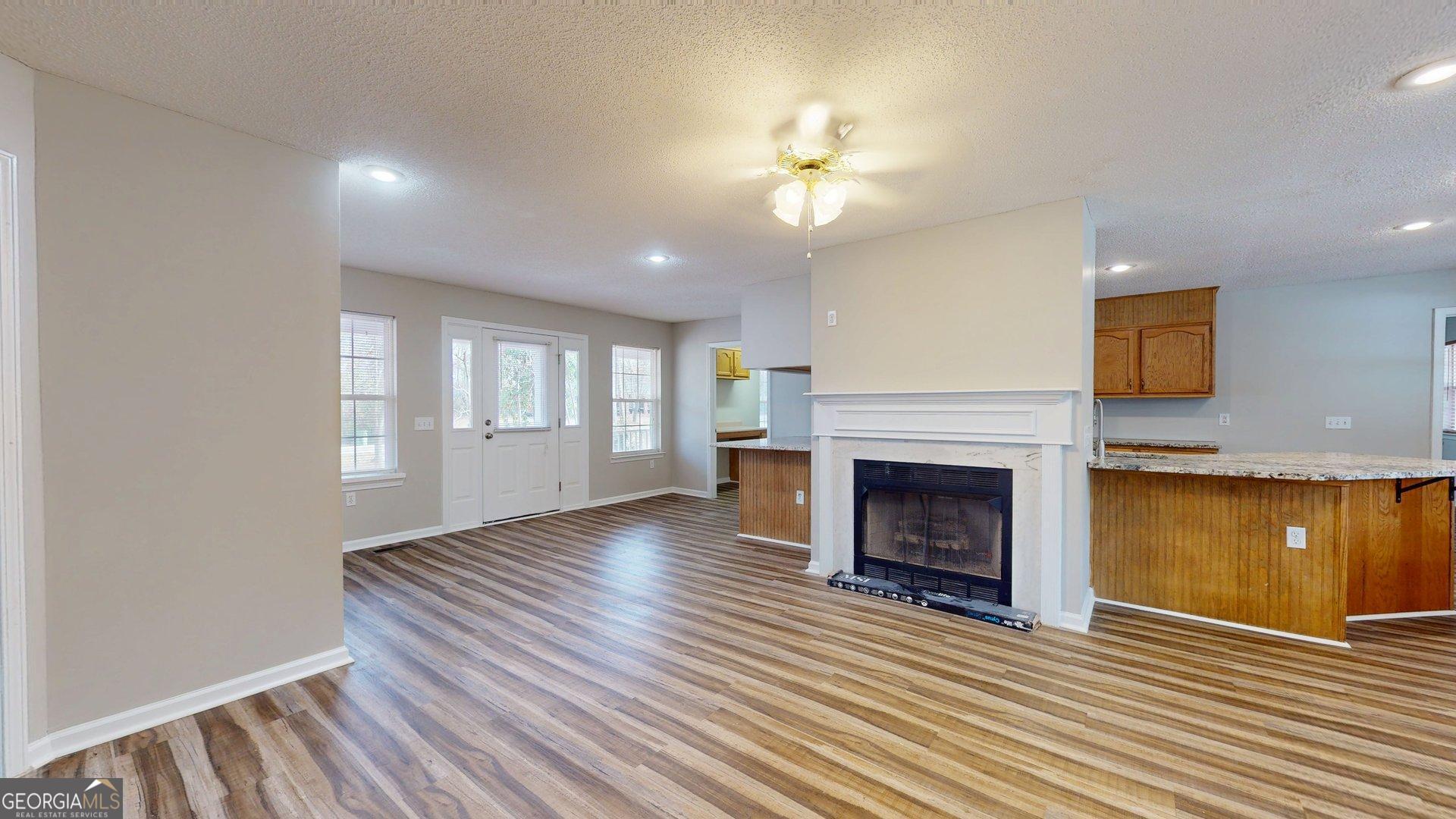 125 Harden Road Statesboro, GA 30458 - Photo 14 of 35 a view of an empty room with window and fire place