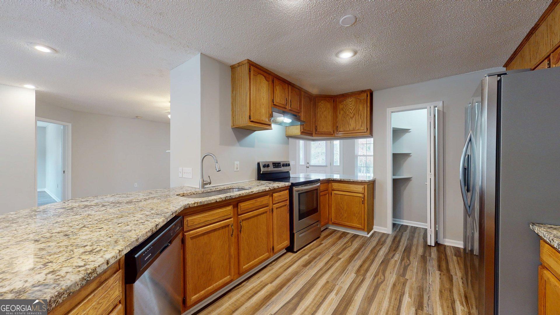 125 Harden Road Statesboro, GA 30458 - Photo 18 of 35 a kitchen with a sink stove and refrigerator