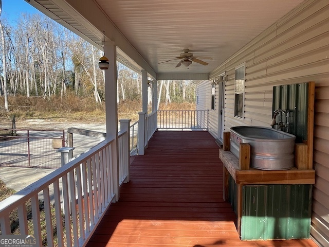 125 Harden Road Statesboro, GA 30458 - Photo 8 of 35 a view of a porch with wooden floor and iron stairs
