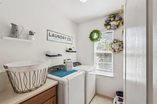 a kitchen with a refrigerator and a window