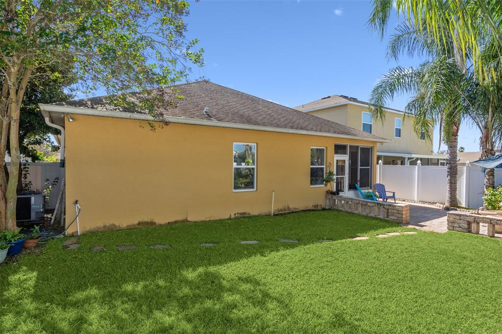 1183 Berkley Ridge Lane Auburndale, FL 33823 - Photo 25 of 25 a view of a house with a yard and sitting area
