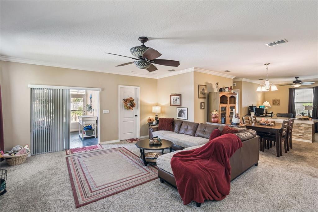 1183 Berkley Ridge Lane Auburndale, FL 33823 - Photo 5 of 25 a living room with furniture and a large window