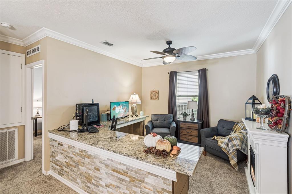 1183 Berkley Ridge Lane Auburndale, FL 33823 - Photo 7 of 25 a living room with furniture a table and decor