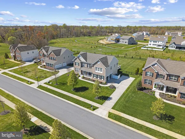 an aerial view of a house with outdoor space