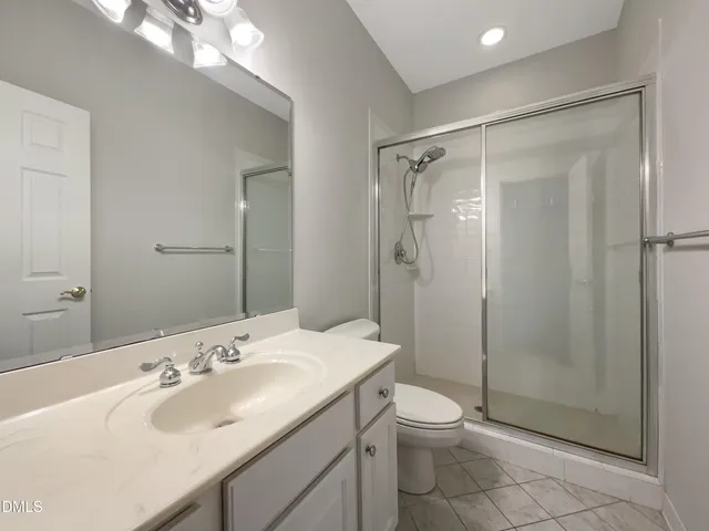 a bathroom with a sink and a large mirror