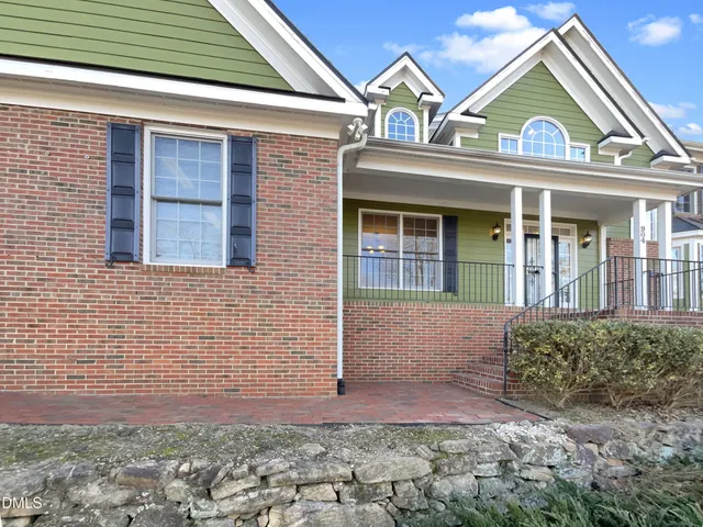 a view of a white house with a large windows