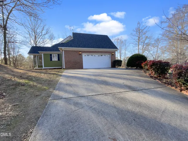 a view of park with large trees