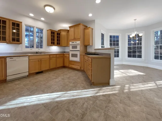 a kitchen with a refrigerator and a sink