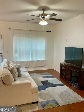 a living room with a couch and a flat screen tv