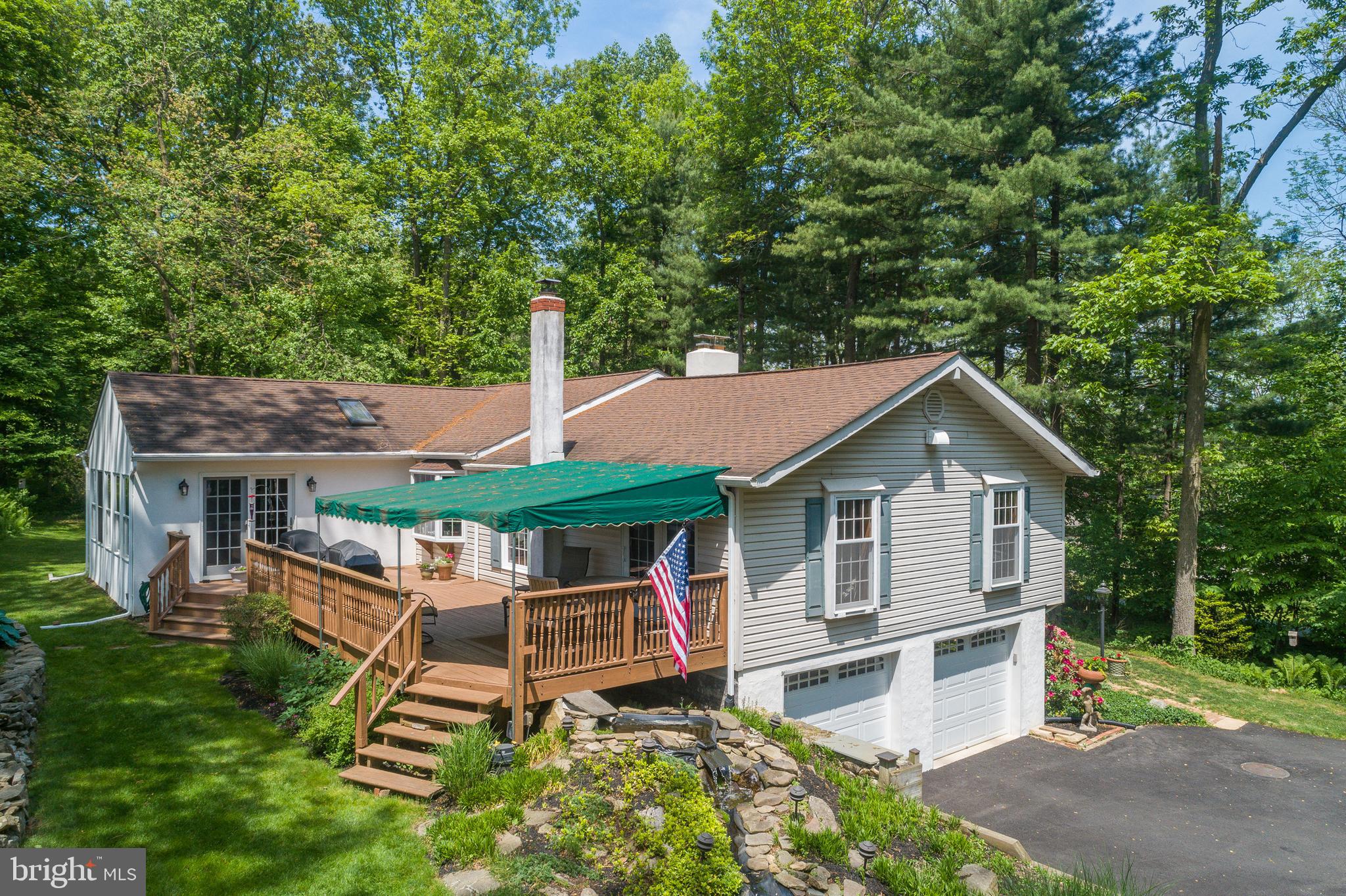 145 Creamery Road Elverson, PA 19520 - Photo 3 of 56 Awning-covered deck with steps to grade