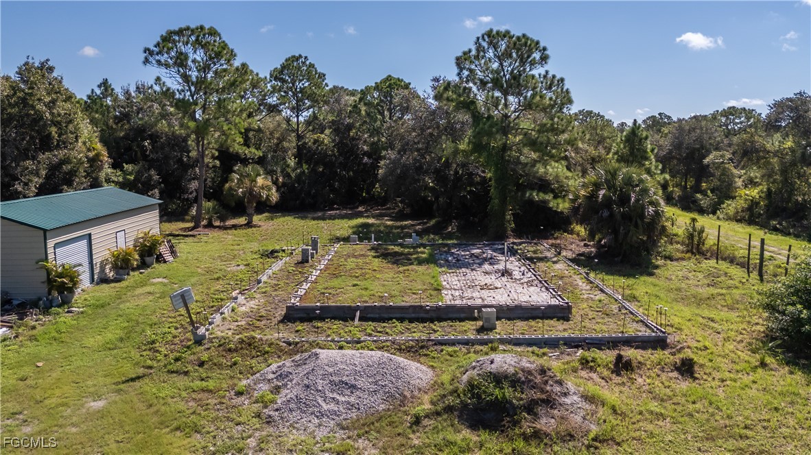 175 South Romero Street Clewiston, FL 33440 - Photo 2 of 19 a view of a yard with plants