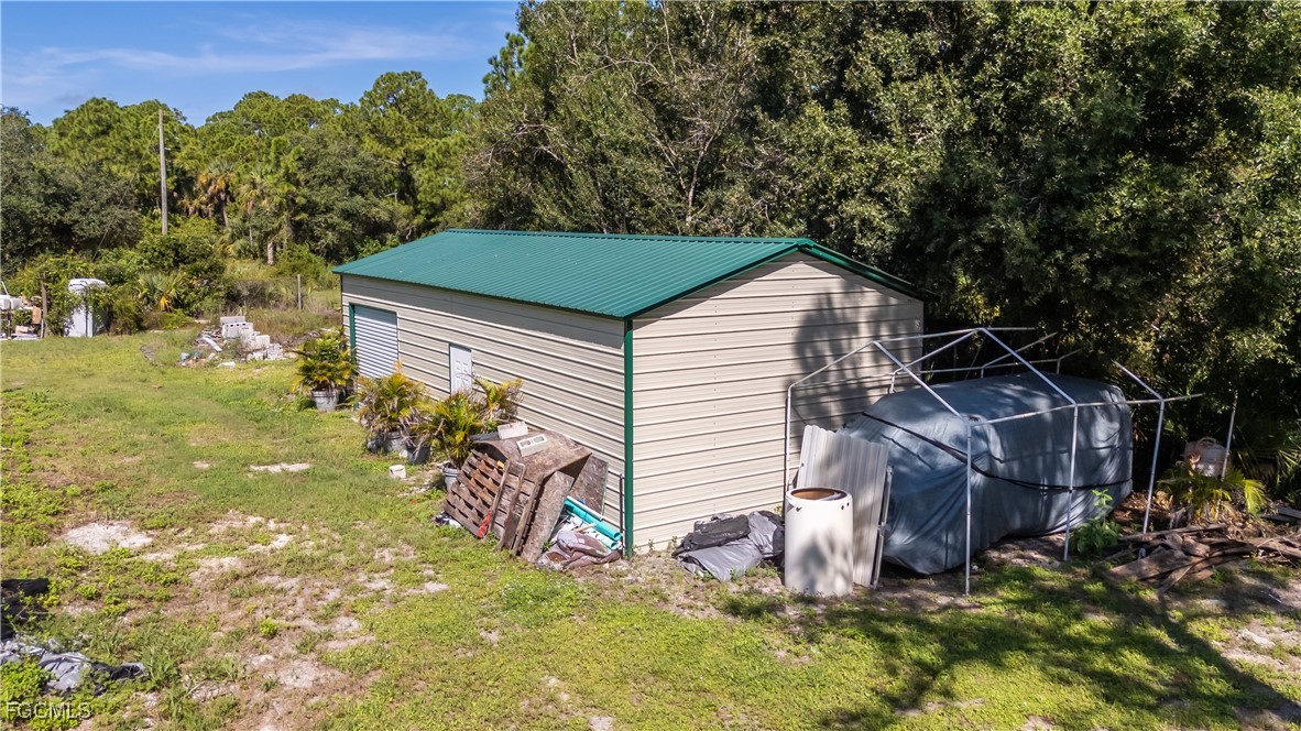 175 South Romero Street Clewiston, FL 33440 - Photo 4 of 19 a front view of a house with a yard