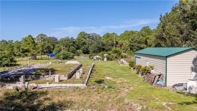 a view of a back yard of the house