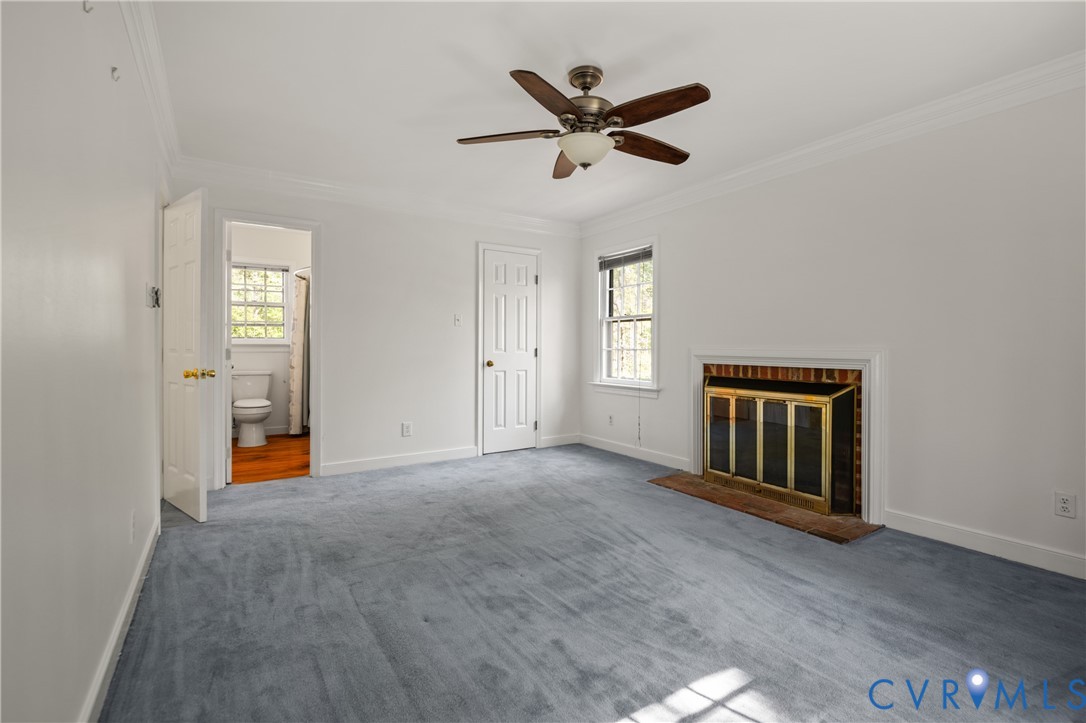 4407 Ketcham Drive Chesterfield, VA 23832 - Photo 14 of 37 an empty room with ceiling fan and windows