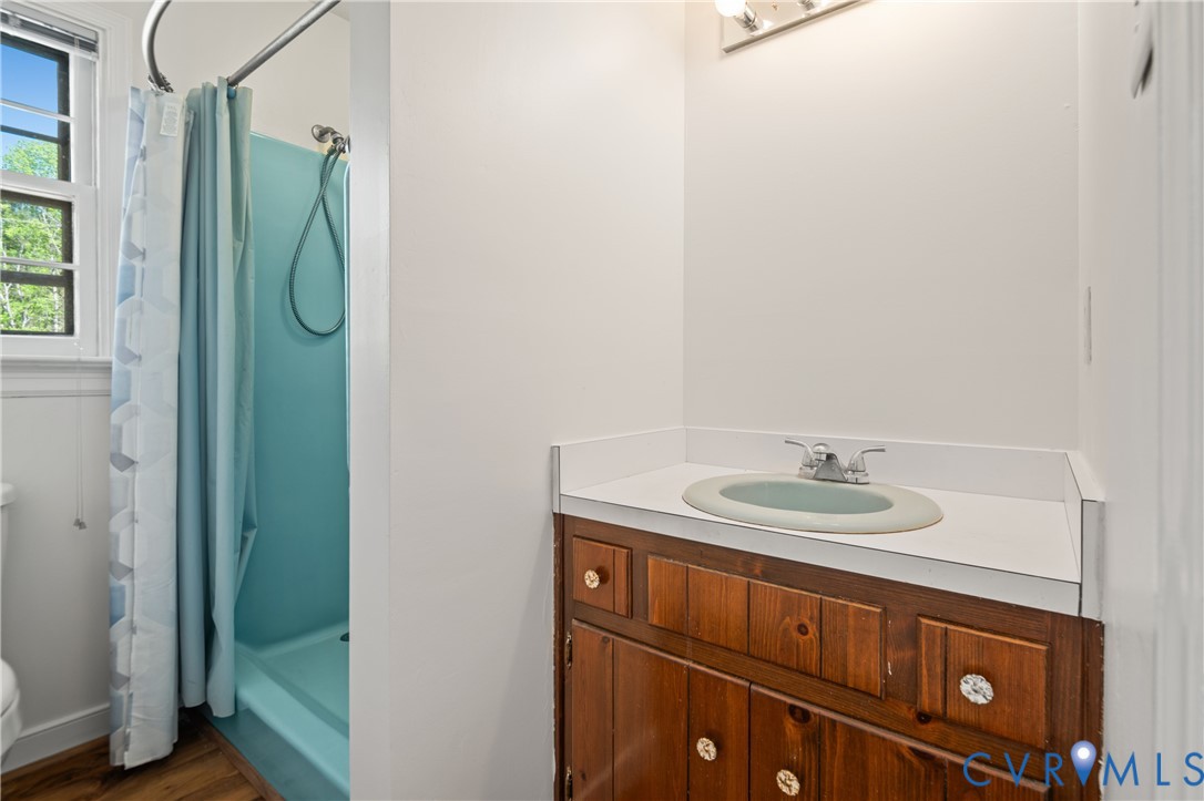 4407 Ketcham Drive Chesterfield, VA 23832 - Photo 15 of 37 a bathroom with a sink and a mirror