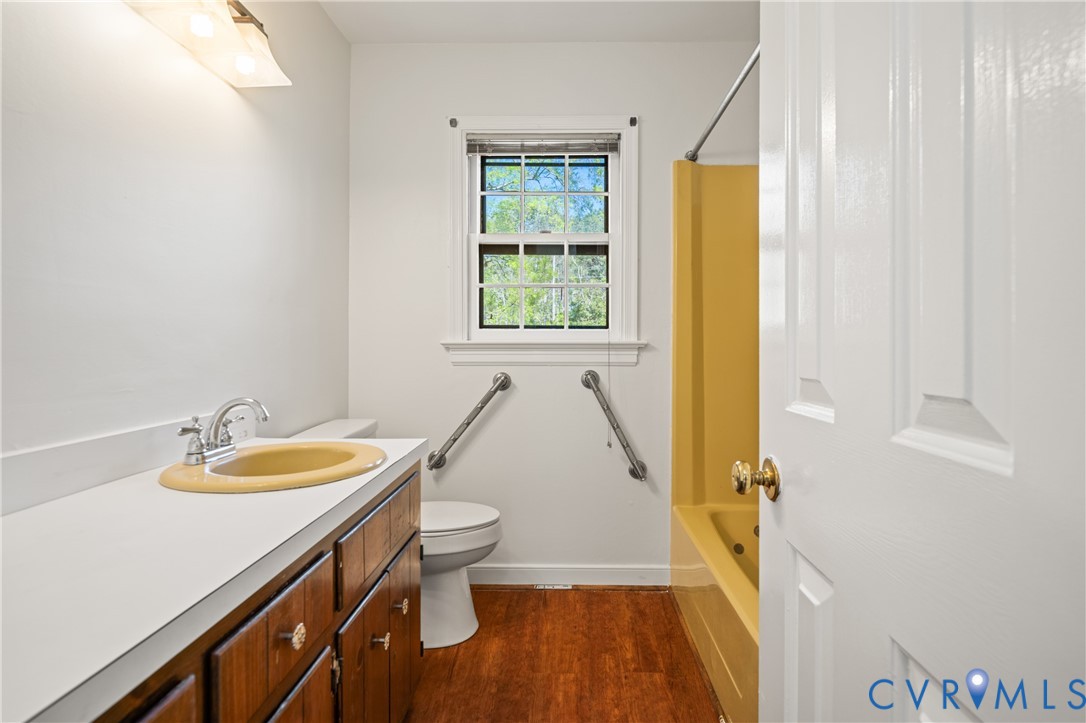 4407 Ketcham Drive Chesterfield, VA 23832 - Photo 19 of 37 a bathroom with a sink a toilet and a window