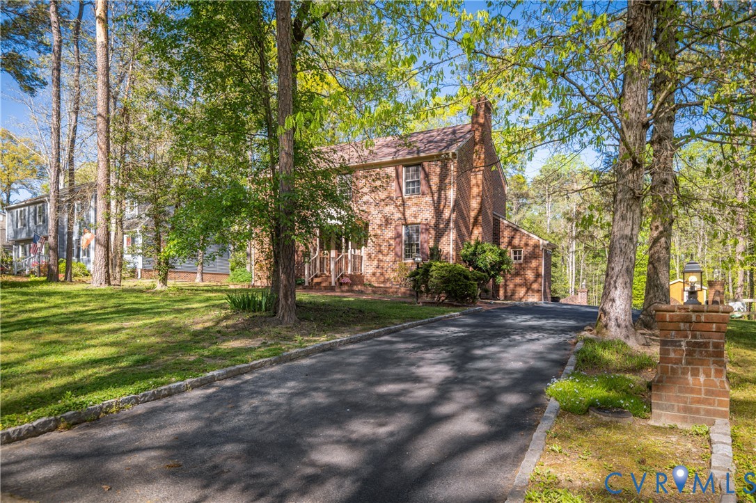 4407 Ketcham Drive Chesterfield, VA 23832 - Photo 2 of 37 a view of a park with large trees