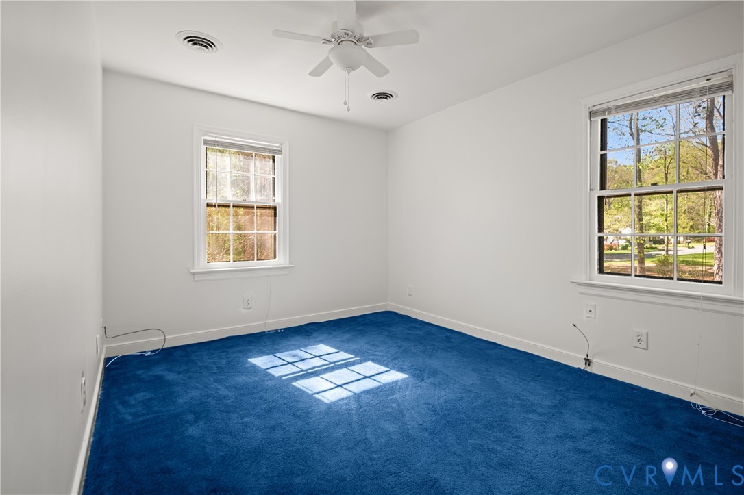 4407 Ketcham Drive Chesterfield, VA 23832 - Photo 22 of 37 a view of empty room with wooden floor and fan