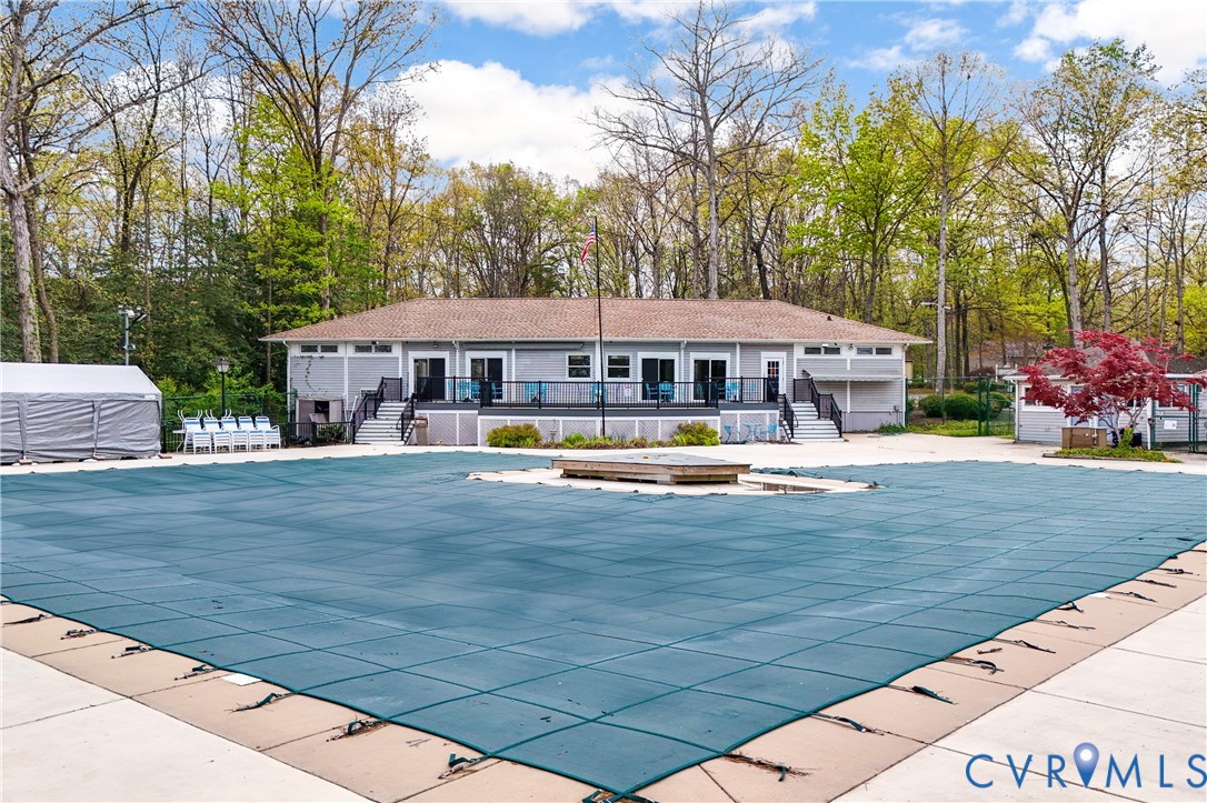 4407 Ketcham Drive Chesterfield, VA 23832 - Photo 33 of 37 a view of swimming pool with outdoor seating and trees in the background
