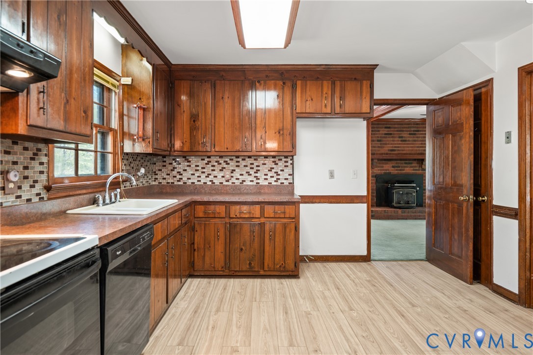 4407 Ketcham Drive Chesterfield, VA 23832 - Photo 7 of 37 a kitchen with a sink refrigerator and cabinets