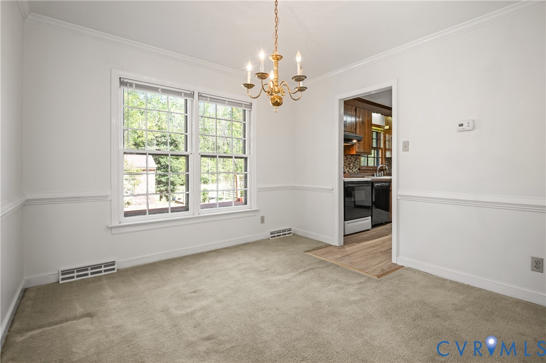 4407 Ketcham Drive Chesterfield, VA 23832 - Photo 9 of 37 an empty room with windows and chandelier fan