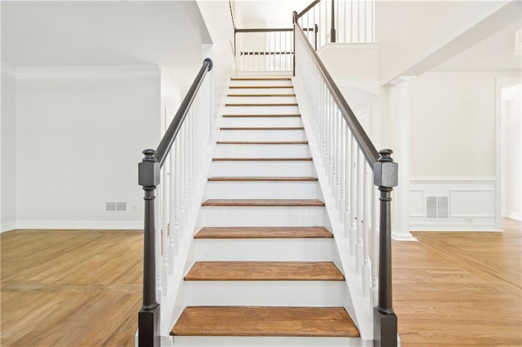 110 Mayes Farm Road Northwest Marietta, GA 30064 - Photo 5 of 49 a view of staircase with wooden floor and white walls