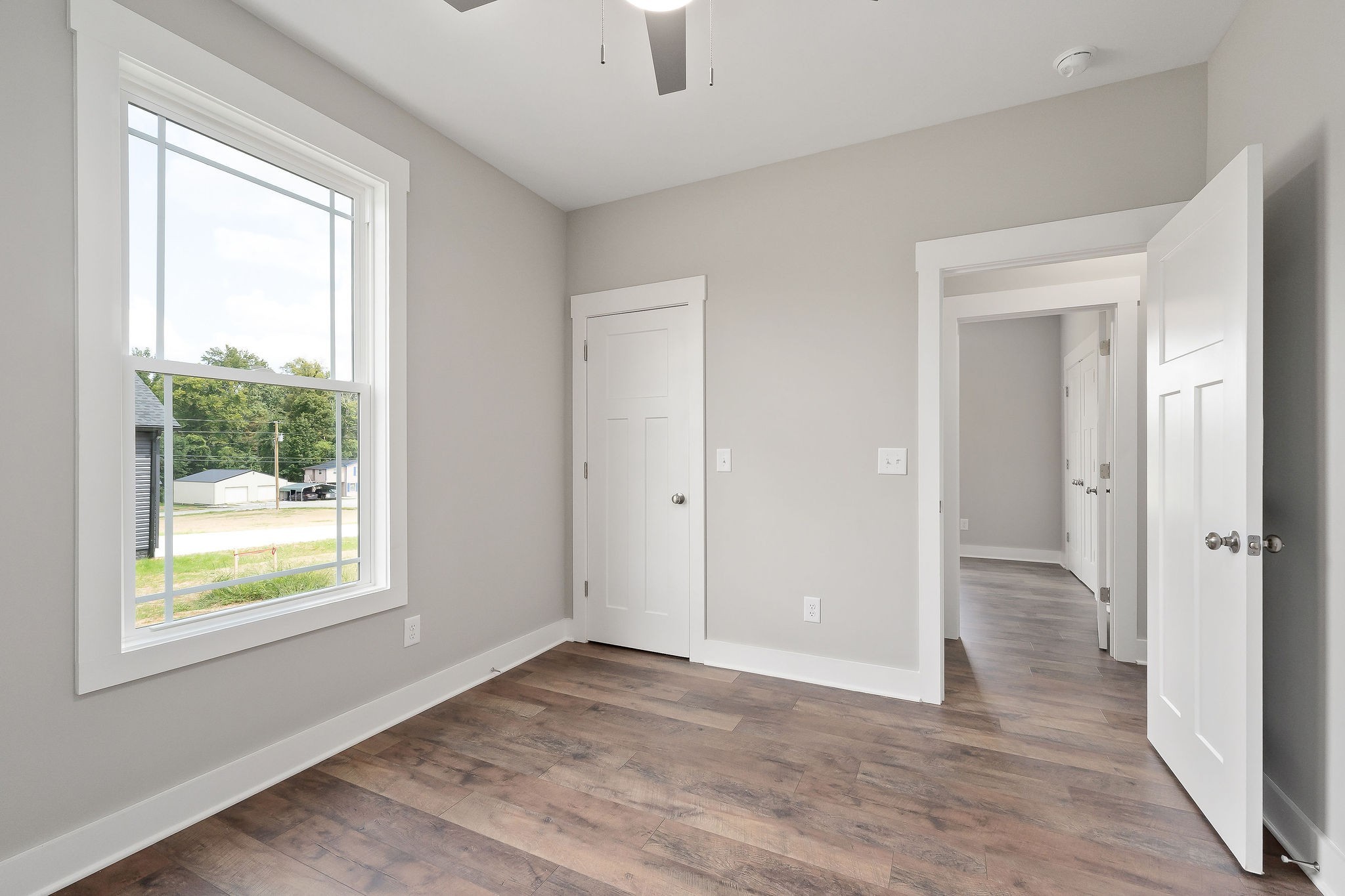 1095 Arch Cope Road Morrison, TN 37357 - Photo 15 of 29 a view of an empty room with wooden floor and a window