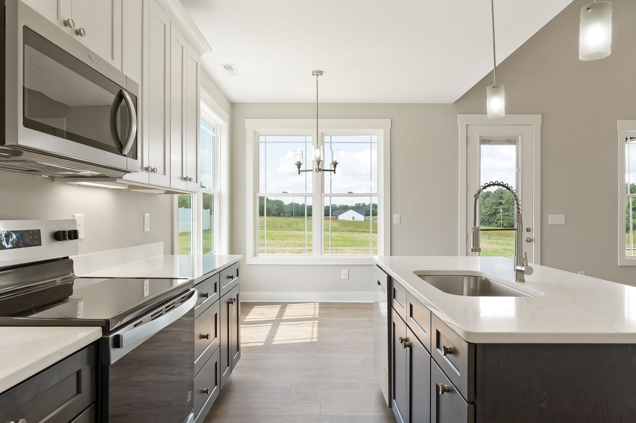 1095 Arch Cope Road Morrison, TN 37357 - Photo 9 of 29 a kitchen with stainless steel appliances granite countertop a sink a stove and a microwave