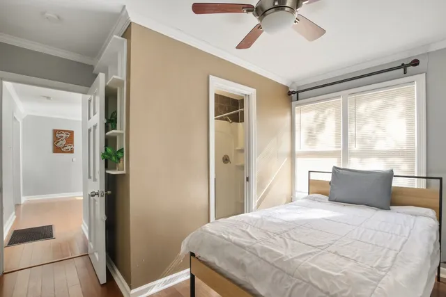 a bedroom with a large bed and a window