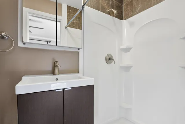 a bathroom with a sink and a mirror