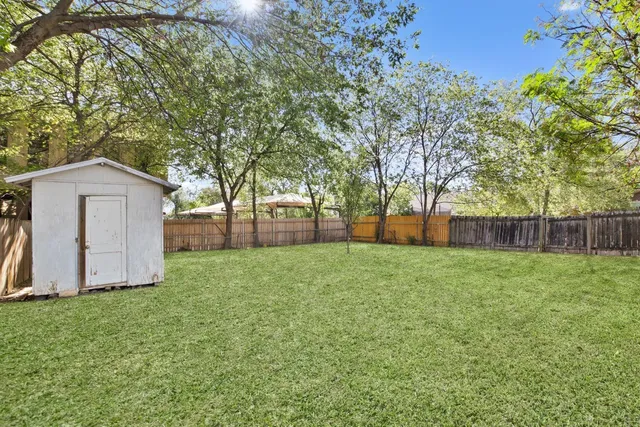 a view of backyard with green space