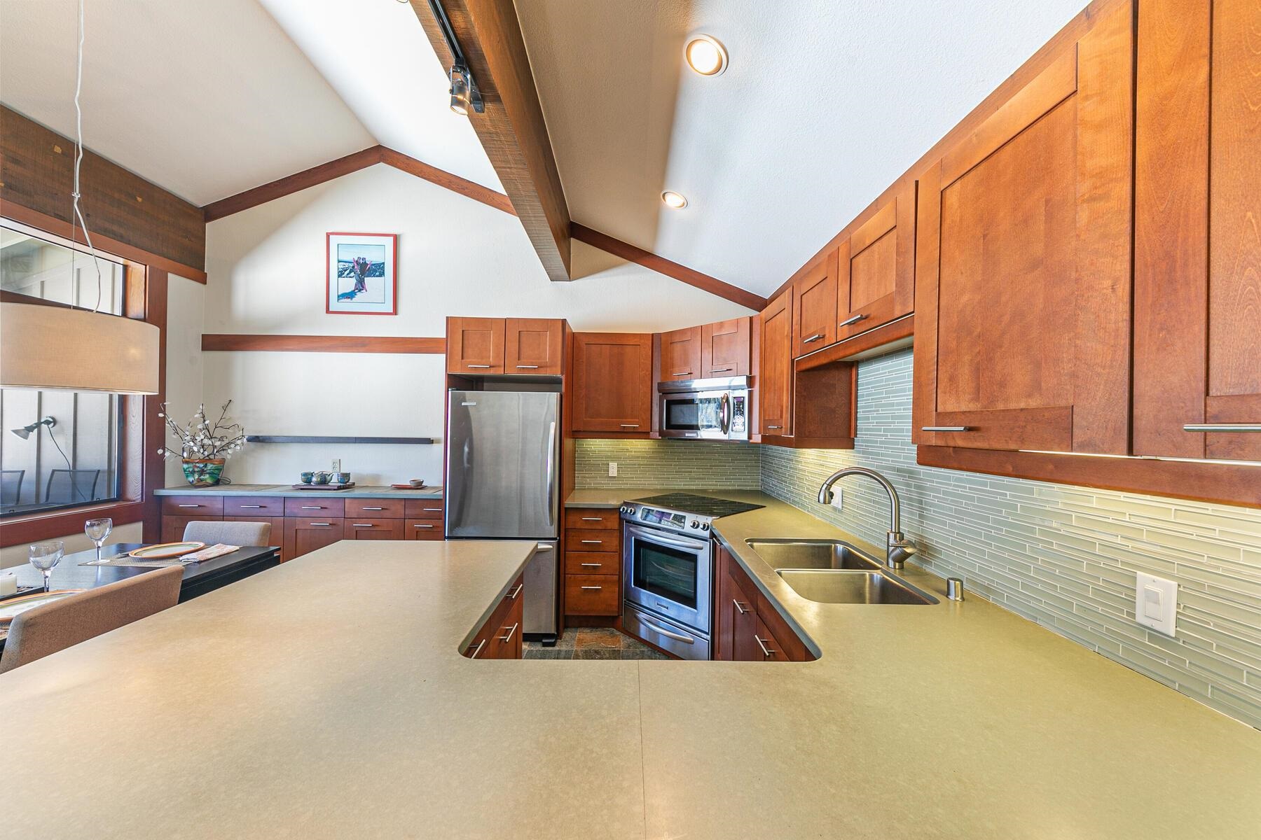 1581 Olympic Vly Road, Unit 3 Olympic Valley, CA 96146 - Photo 11 of 28 a view of a kitchen with a sink and living room