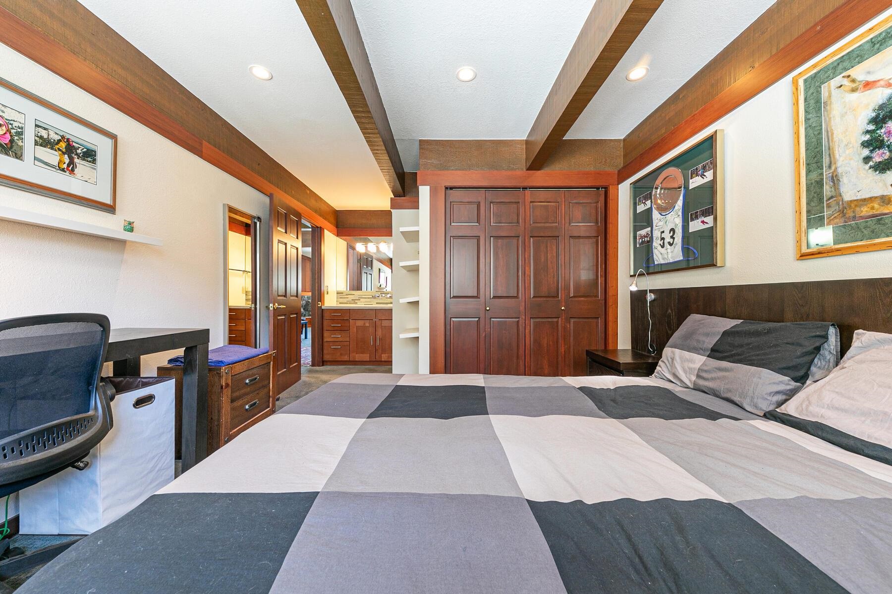 1581 Olympic Vly Road, Unit 3 Olympic Valley, CA 96146 - Photo 15 of 28 a bedroom with a large bed a flat tv screen and dresser