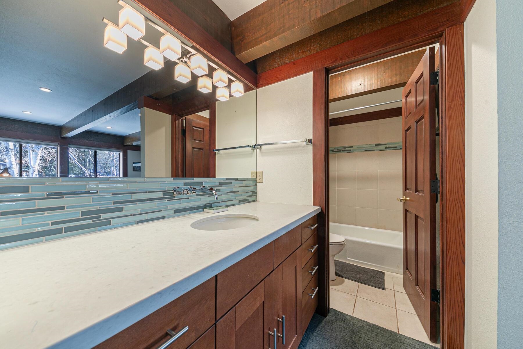 1581 Olympic Vly Road, Unit 3 Olympic Valley, CA 96146 - Photo 16 of 28 a bathroom with a sink and a mirror