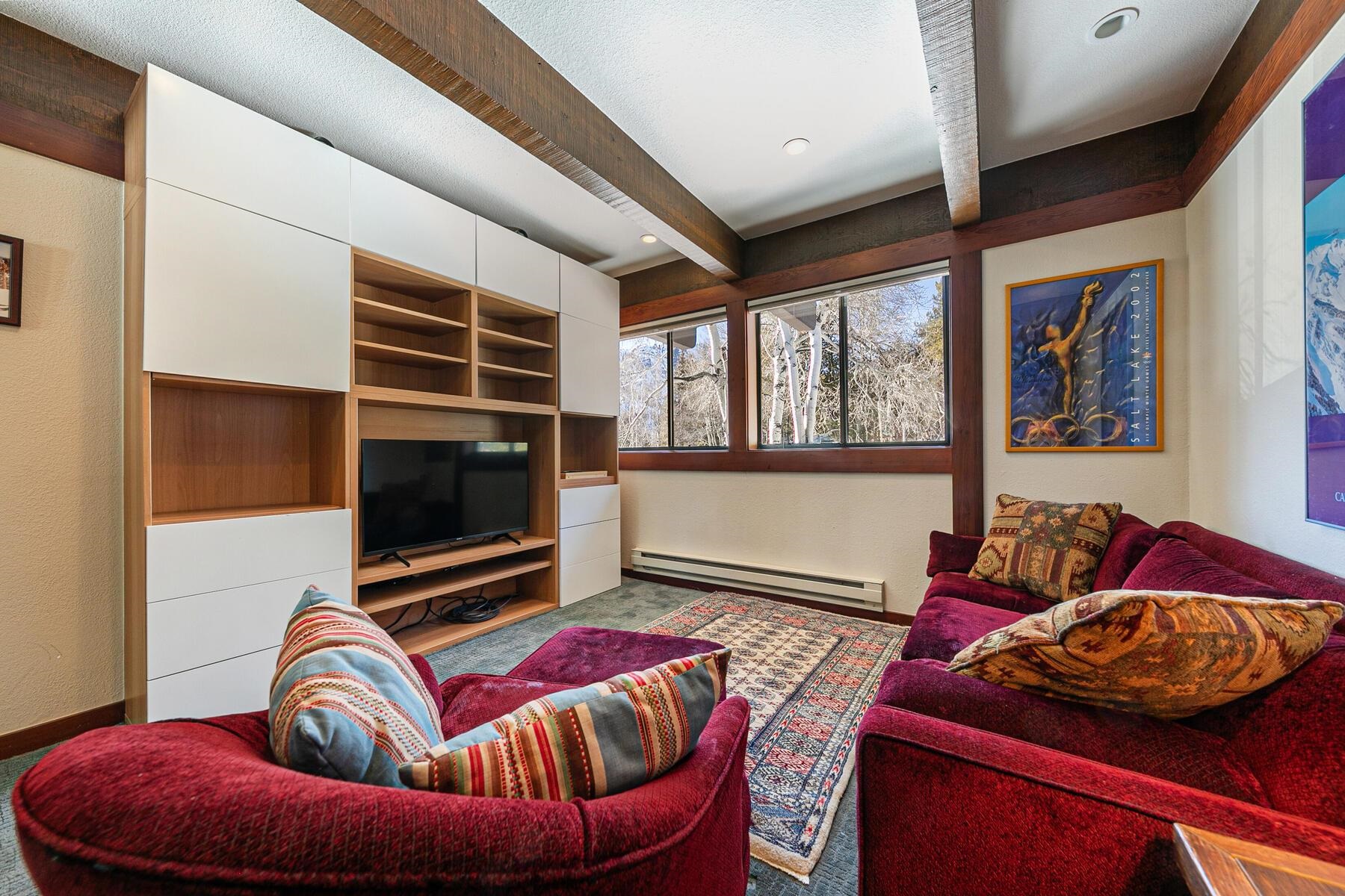 1581 Olympic Vly Road, Unit 3 Olympic Valley, CA 96146 - Photo 20 of 28 a living room with furniture and a flat screen tv