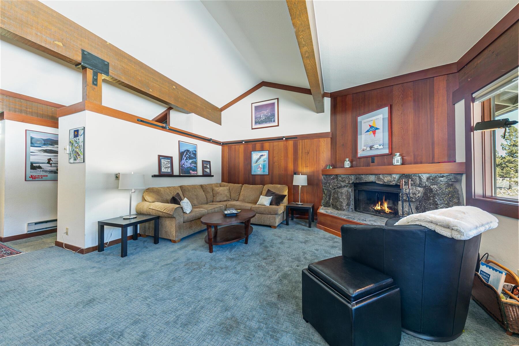 1581 Olympic Vly Road, Unit 3 Olympic Valley, CA 96146 - Photo 2 of 28 a living room with fireplace furniture and a large window
