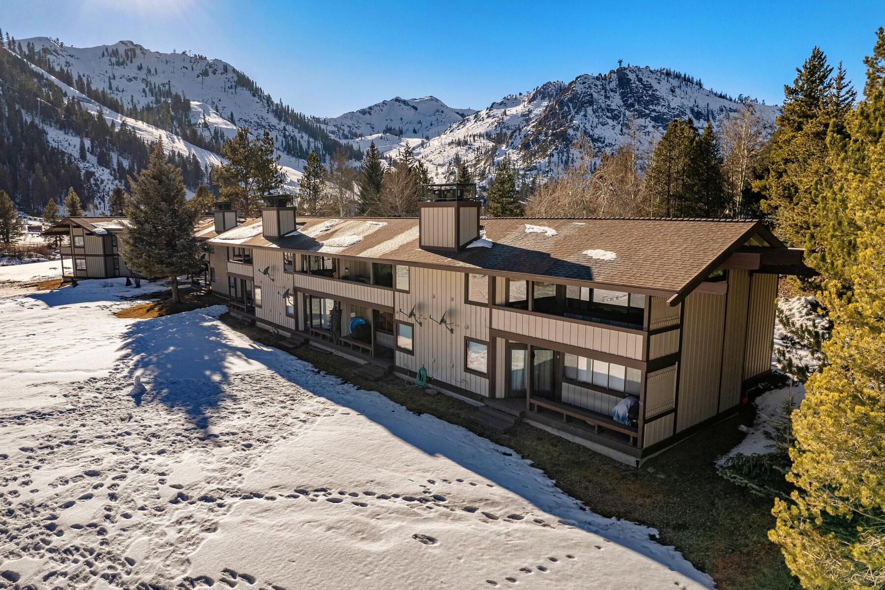 1581 Olympic Vly Road, Unit 3 Olympic Valley, CA 96146 - Photo 24 of 28 a view of a house with a yard covered in snow