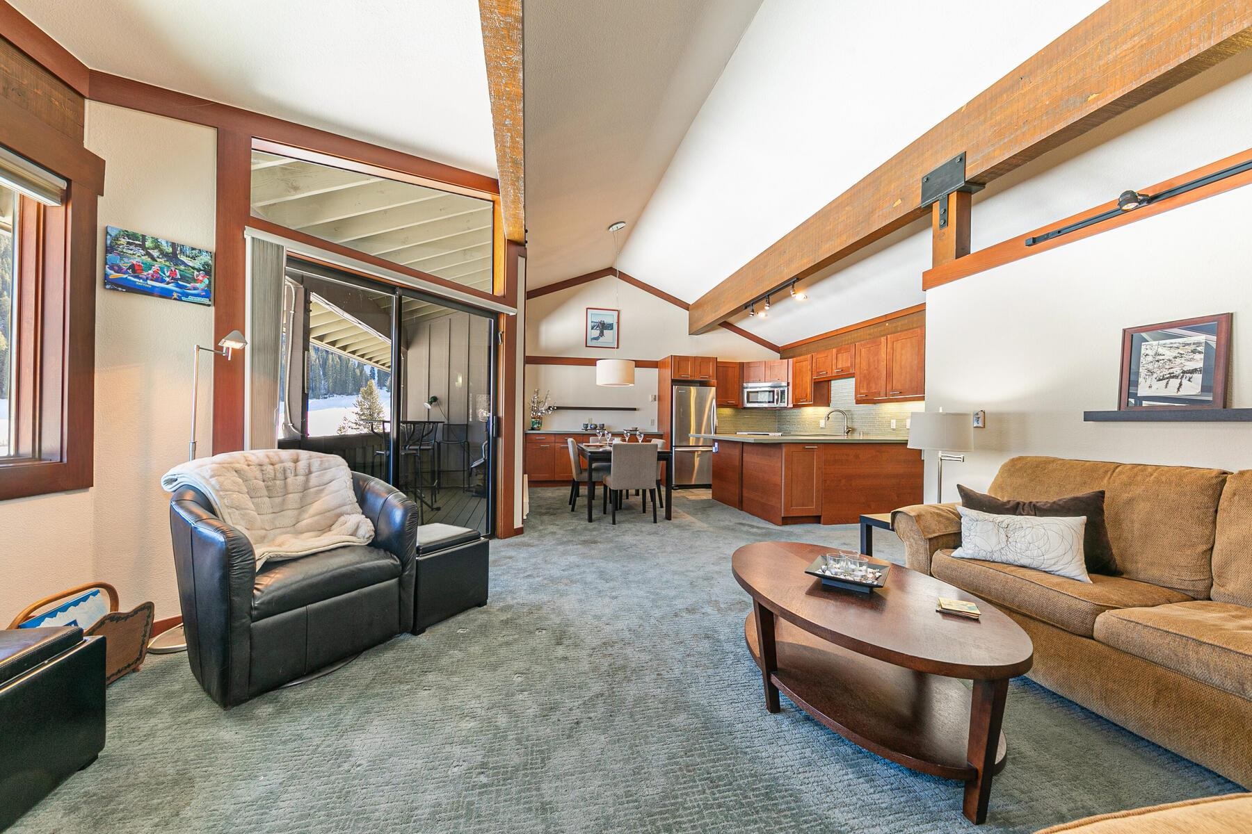 1581 Olympic Vly Road, Unit 3 Olympic Valley, CA 96146 - Photo 3 of 28 a living room with furniture and a large window
