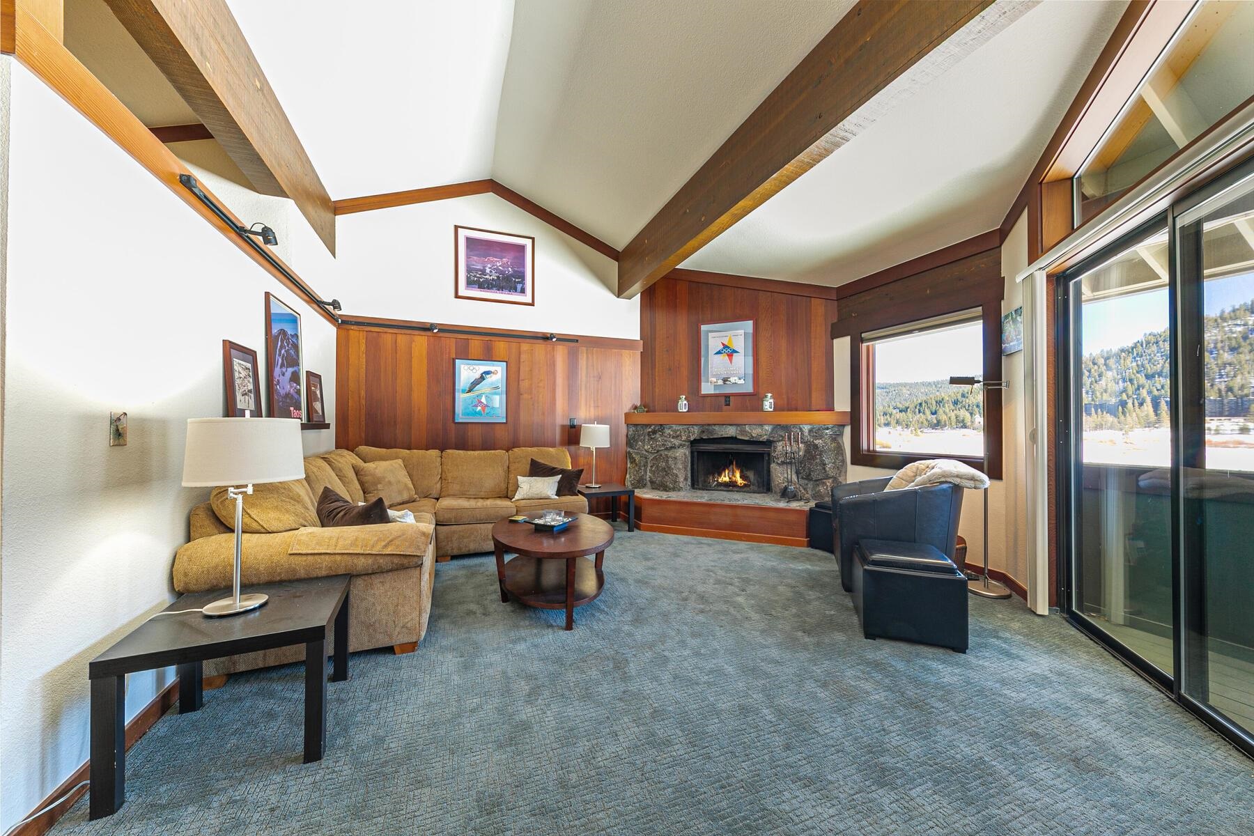 1581 Olympic Vly Road, Unit 3 Olympic Valley, CA 96146 - Photo 4 of 28 a living room with fireplace furniture and a large window