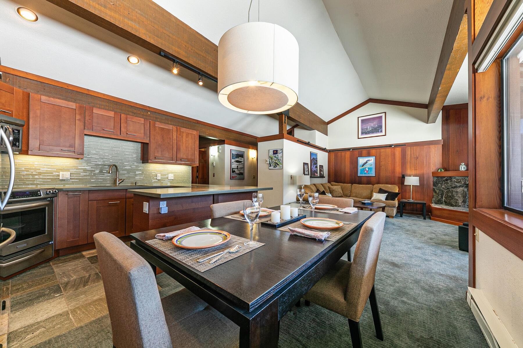 1581 Olympic Vly Road, Unit 3 Olympic Valley, CA 96146 - Photo 7 of 28 a dinning table and chairs in a kitchen