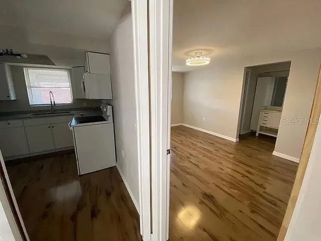 a view of a kitchen from the hallway