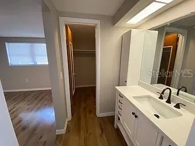 a bathroom with a sink and a mirror