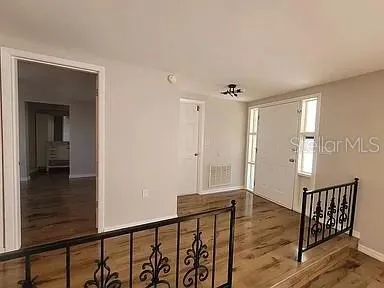 a bathroom with a double vanity sink and mirror with shower