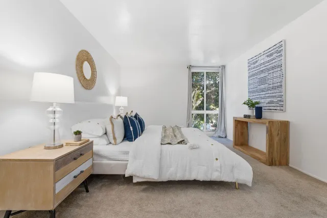 a bed room with a bed and a bathroom