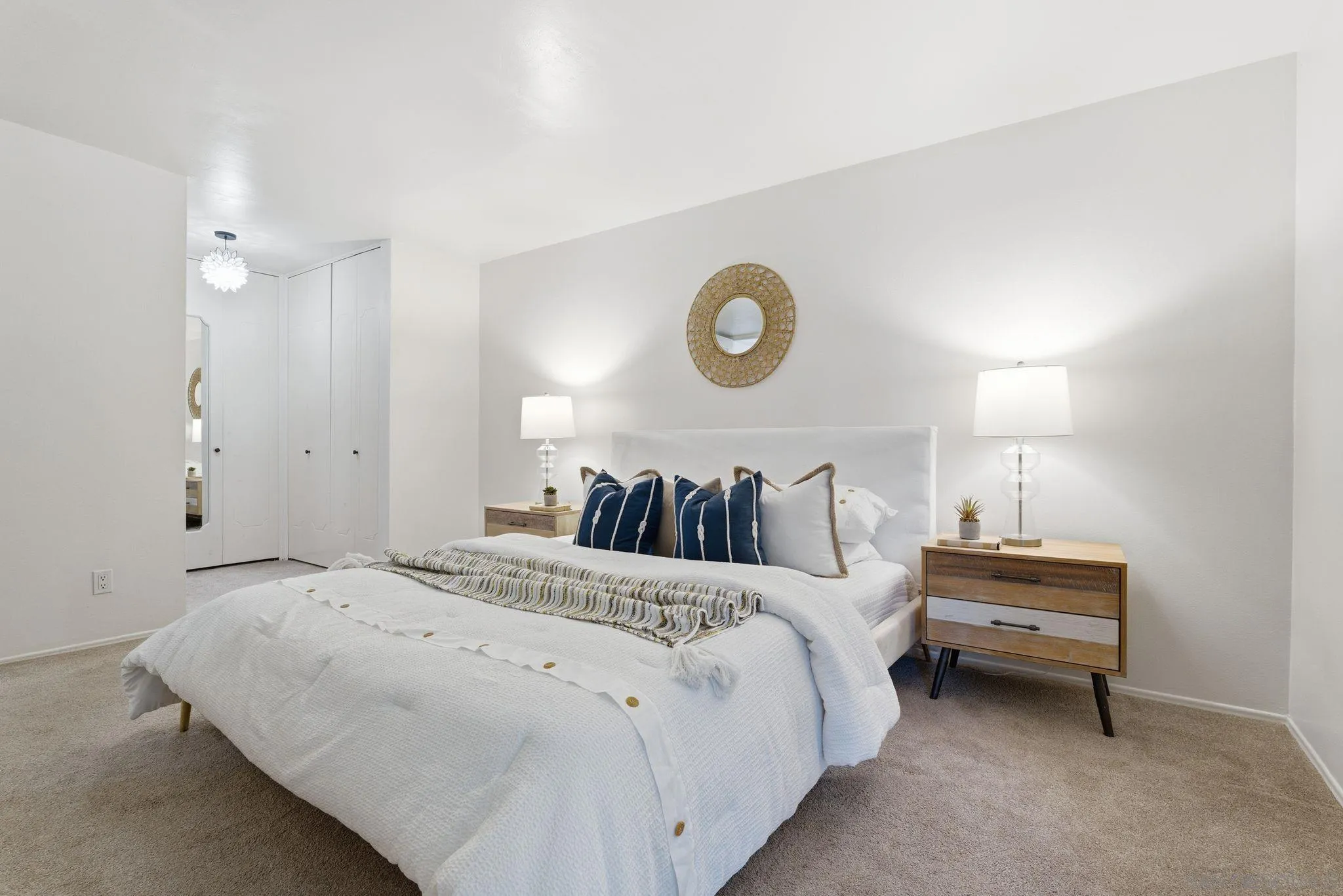 6455 La Jolla Boulevard, Unit 206 La Jolla, CA 92037 - Photo 12 of 24 a bed room with a bed and a lamp