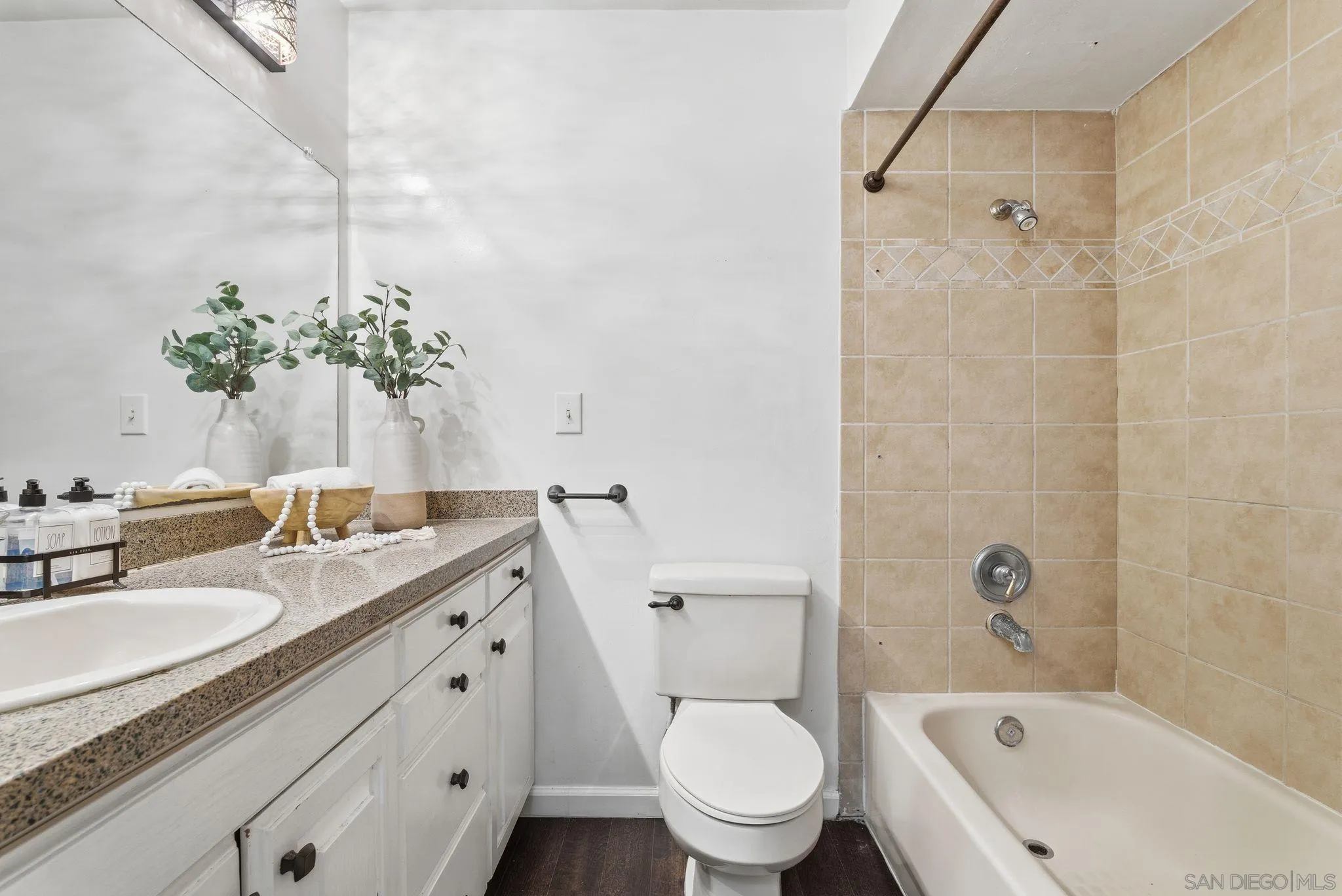 6455 La Jolla Boulevard, Unit 206 La Jolla, CA 92037 - Photo 15 of 24 a bathroom with a granite countertop sink a toilet and shower