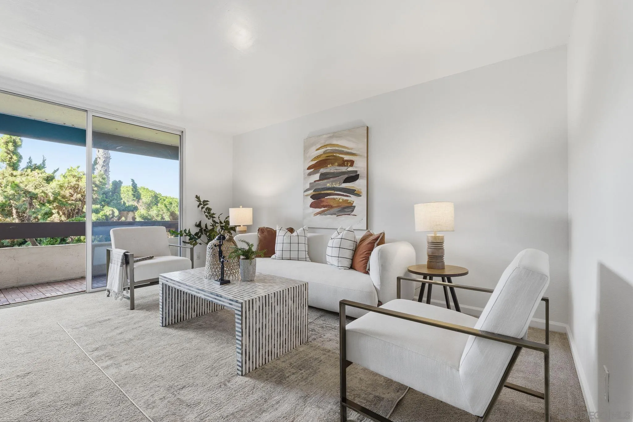 6455 La Jolla Boulevard, Unit 206 La Jolla, CA 92037 - Photo 7 of 24 a living room with furniture and a large window