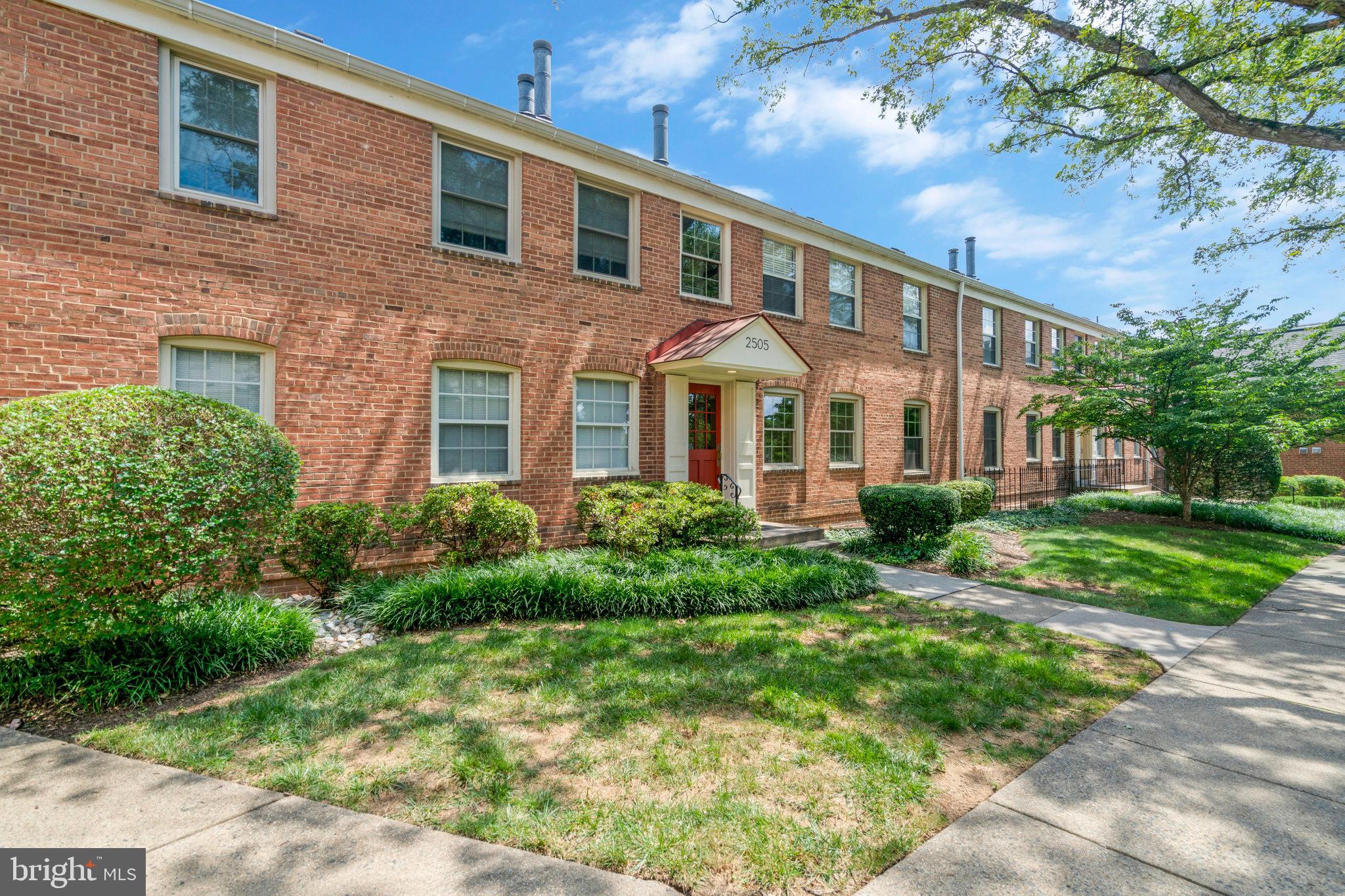 2505 Arlington Boulevard, Unit 102 Arlington, VA 22201 - Photo 1 of 26 a front view of a house with garden and porch